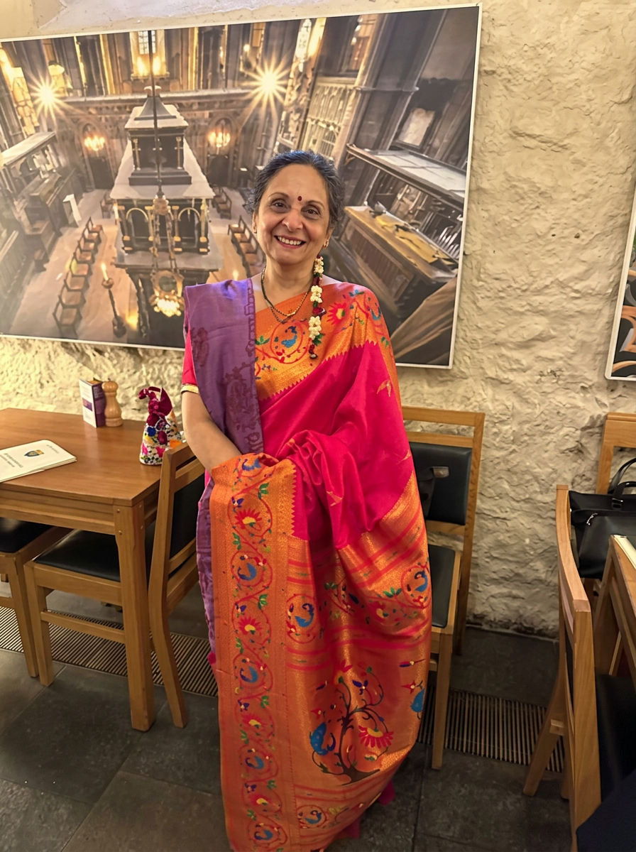 Harsha Shukla MBE in a bright pink and orange sari